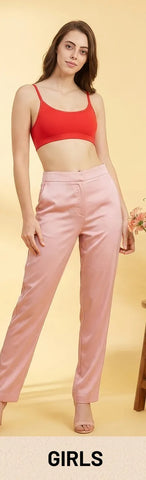 Young woman in red crop top and pink satin pants casual loungewear look