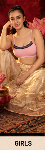 Young woman in red crop top and pink satin pants casual loungewear look